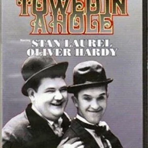 Laurel & Hardy: Towed In A Hole